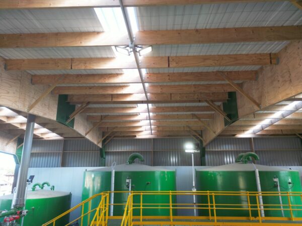 Inside of Permapine Treatment Plant with rafters and boilers