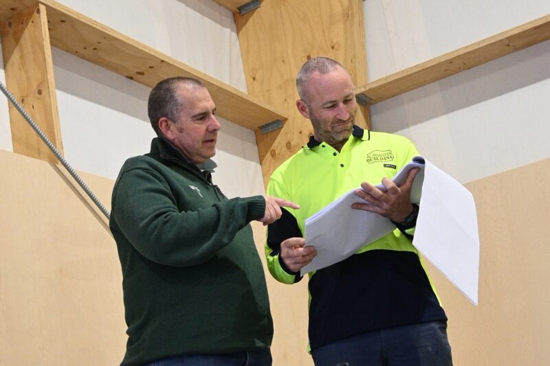 TimberSpan Business Manager with Builder looking at architectural drawings for a warehouse